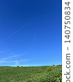 A landscape with a blue sky and clouds 140750834