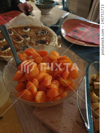 Glazed carrots and pumpkin pie for Thanksgiving dish 140751713