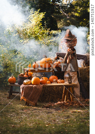 Autumn Harvest Scene with Scarecrow and Pumpkins Autumn Harvest Scene with Scarecrow and Pumpkins 140751917