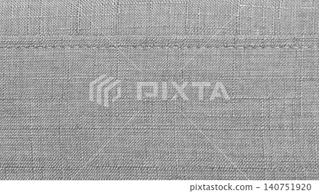 Light grey textile background with fiber detail and stitching Light grey textile background with fiber detail and stitching 140751920