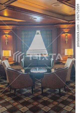 The luxury cruise ship's classic and upscale onboard lounge and sofa seating. The luxury cruise ship's classic and upscale onboard lounge and sofa seating. 140752004