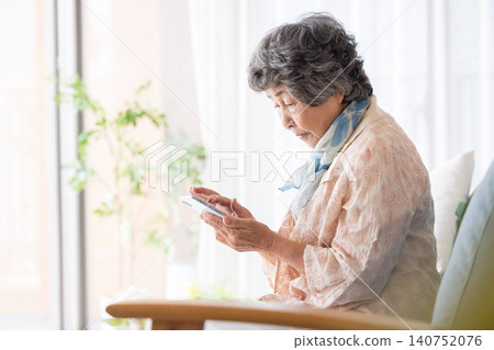 Senior woman answering a suspicious call Senior woman answering a suspicious call 140752076