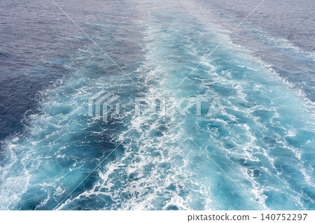 The dynamic wake and white wave of a luxury cruise ship sailing across the open sea. The dynamic wake and white wave of a luxury cruise ship sailing across the open sea. 140752297