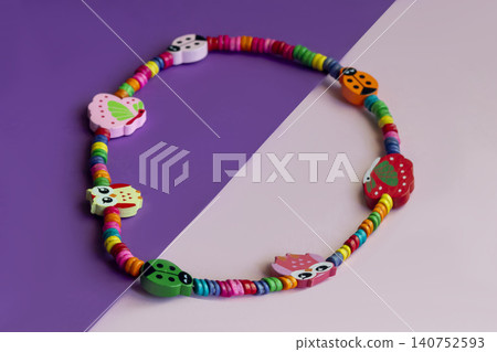 Sets of multi-colored beads and seed beads for children's arts and crafts Sets of multi-colored beads and seed beads for children's arts and crafts 140752593