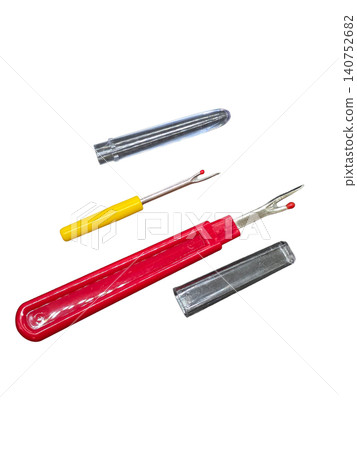 Two seam rippers with protective caps isolated on transparent background. Handy sewing tools for removing stitches, tailoring repairs and fabric craft work. Two seam rippers with protective caps isolated on transparent background. Handy sewing tools for removing stitches, tailoring repairs and fabric craft work. 140752682