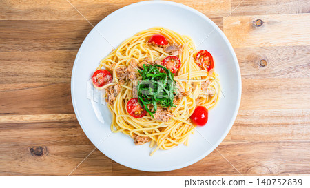 Cold pasta with tuna and cherry tomatoes, garnished with shiso leaves - a perfect summer dish. Cold pasta with tuna and cherry tomatoes, garnished with shiso leaves - a perfect summer dish. 140752839