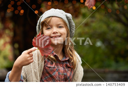 Happy, leaf and portrait of child in park with smile for playing, freedom and adventure outdoors. Childhood, happiness and young girl with plants in nature for playing, relaxing and fun in autumn Happy, leaf and portrait of child in park with smile for playing, freedom and adventure outdoors. Childhood, happiness and young girl with plants in nature for playing, relaxing and fun in autumn 140753409