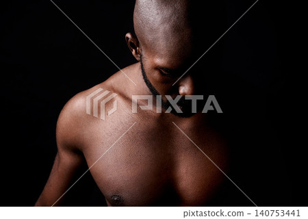 Black man, muscle and fitness with shadow for workout or exercise on a dark studio background. Closeup of young African male person or bodybuilder with masculine or muscular body on mockup space 140753441