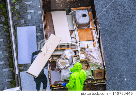 Apartment renovation in Yokohama, Japan. Waste materials are being loaded onto trucks one after another. (Yokohama city) 140753446