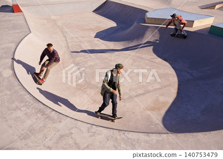 Friends, sports and men with skateboard, ramp or bowl action at a skate park for stunt training. Freedom, adrenaline and gen z skater people with energy, balance or skill, exercise or performance Friends, sports and men with skateboard, ramp or bowl action at a skate park for stunt training. Freedom, adrenaline and gen z skater people with energy, balance or skill, exercise or performance 140753479