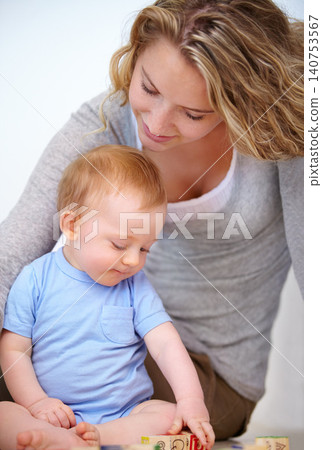Baby, play and happy with mother, relaxing and love together with child and care for motherhood. Infant, mom and smile for affection, nurture and home for growth and babysitting with family bonding 140753567