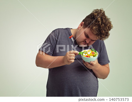 Bowl, man and thinking with salad in studio for healthy diet, weight loss and examine food. Plus size, male person and contemplating with organic meal for detox, lifestyle change and nutrition Bowl, man and thinking with salad in studio for healthy diet, weight loss and examine food. Plus size, male person and contemplating with organic meal for detox, lifestyle change and nutrition 140753573