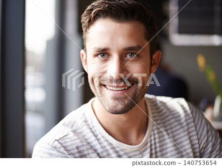 Handsome man, face and portrait with smile at cafe for morning, ambition or pride at indoor restaurant. Attractive, young or happy male person with positive attitude, beard or mindset at coffee shop Handsome man, face and portrait with smile at cafe for morning, ambition or pride at indoor restaurant. Attractive, young or happy male person with positive attitude, beard or mindset at coffee shop 140753654