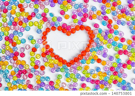 Background heart made of colored acrylic beads. Valentynes day Background heart made of colored acrylic beads. Valentynes day 140753801