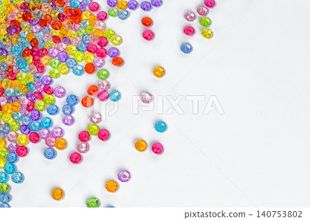 Background of colored beads on a white background Background of colored beads on a white background 140753802