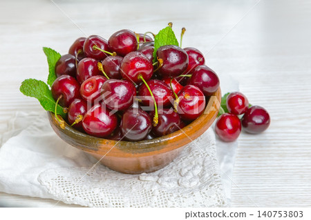 Cherry, Cherry in a clay plate on the table Cherry, Cherry in a clay plate on the table 140753803