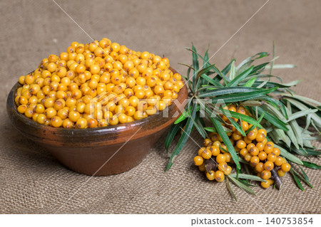 Buckthorn, Sea buckthorn berries in a bowl Buckthorn, Sea buckthorn berries in a bowl 140753854