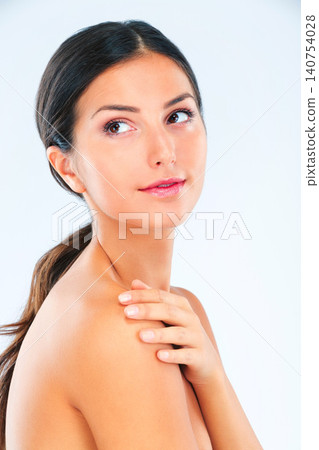 Thinking, woman and natural beauty with skincare, wellness and glow with dermatology on white background. Cosmetics, self care and touching skin with shine, treatment and moisturizer in studio 140754028