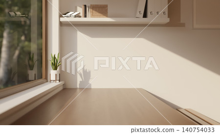 Modern workspace with wooden table by window and minimal bookshelf on white wall under warm sunlight Modern workspace with wooden table by window and minimal bookshelf on white wall under warm sunlight 140754033