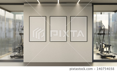 Triple black frames on white wall in modern fitness gym lounge with glass wall under soft lighting. Triple black frames on white wall in modern fitness gym lounge with glass wall under soft lighting. 140754038