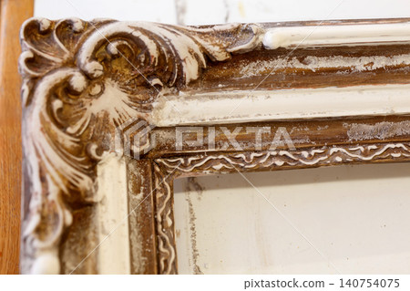 Wooden Frame With Intricate Design Displayed on a Table in a Studio During Daylight Wooden Frame With Intricate Design Displayed on a Table in a Studio During Daylight 140754075