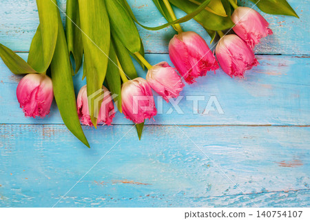 Bouquet of tulips on blue wooden table. Happy women's day. 8 March., Mother's Day. Bouquet of tulips on blue wooden table. Happy women's day. 8 March., Mother's Day. 140754107