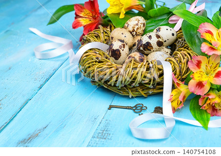 Spring background. Bouquet of flowers on a wooden background and a nest with eggs. spring Spring background. Bouquet of flowers on a wooden background and a nest with eggs. spring 140754108