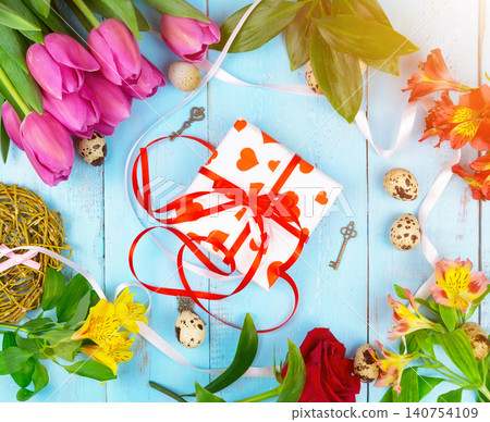 flowers on wooden blue background. Conception holiday, March 8, Mother's Day. Flat lay and copy space flowers on wooden blue background. Conception holiday, March 8, Mother's Day. Flat lay and copy space 140754109