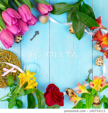 Pink tulips on wooden blue background. Conception holiday, March 8, Mother's Day. Flat lay and copy space Pink tulips on wooden blue background. Conception holiday, March 8, Mother's Day. Flat lay and copy space 140754111