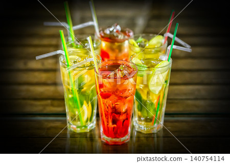 Glasses of cocktails on bar background Glasses of cocktails on bar background 140754114