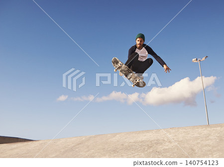 Skateboard, blue sky and man with ramp, challenge and training for a competition, talent and sunshine. Adventure, person and skater with practice for technique or balance with fitness, energy or jump Skateboard, blue sky and man with ramp, challenge and training for a competition, talent and sunshine. Adventure, person and skater with practice for technique or balance with fitness, energy or jump 140754123