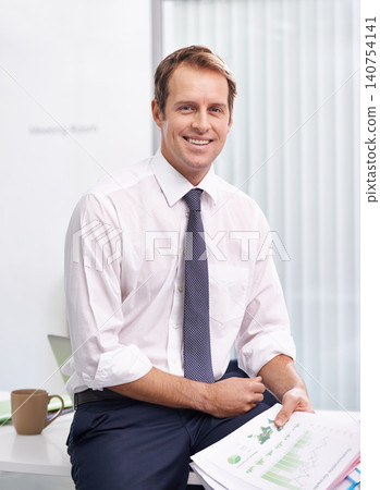 Paperwork, statistics and portrait of man in office with smile, sales review or profit report at accounting agency. Documents, business growth or development with financial advisor at desk at startup Paperwork, statistics and portrait of man in office with smile, sales review or profit report at accounting agency. Documents, business growth or development with financial advisor at desk at startup 140754141