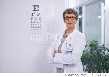 Letter, chart and woman with optometrist for eye exam, arms crossed with confidence and senior doctor at clinic. Alphabet, glasses for vision and prescription lens with assessment and ophthalmology Letter, chart and woman with optometrist for eye exam, arms crossed with confidence and senior doctor at clinic. Alphabet, glasses for vision and prescription lens with assessment and ophthalmology 140754167