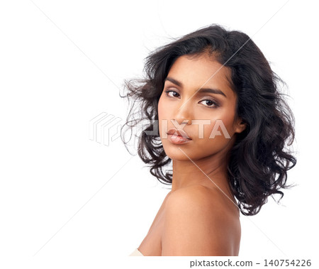Beauty, makeup and portrait for Indian woman, skincare and self care on white background. Confidence, hairstyle and curls for face of ethnic female model, natural and salon treatment in studio Beauty, makeup and portrait for Indian woman, skincare and self care on white background. Confidence, hairstyle and curls for face of ethnic female model, natural and salon treatment in studio 140754226