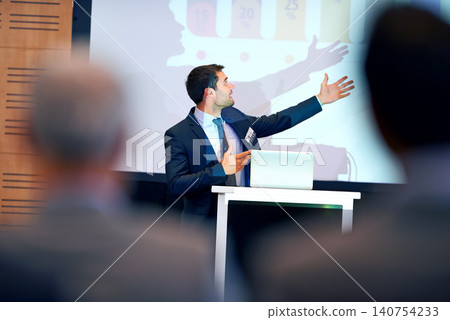 Business man, presentation and pointing at projector screen, conference or workshop with laptop for slideshow. Corporate training, seminar and speaker with info, audience and professional speech Business man, presentation and pointing at projector screen, conference or workshop with laptop for slideshow. Corporate training, seminar and speaker with info, audience and professional speech 140754233