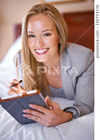 Hotel, business and portrait of happy woman on tablet for website, social media and networking on bed. Online, remote work and person on digital tech for contact, research and internet on work trip Hotel, business and portrait of happy woman on tablet for website, social media and networking on bed. Online, remote work and person on digital tech for contact, research and internet on work trip 140754236