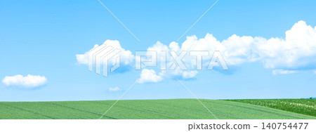 The summer scenery of Biei, Hokkaido, with its blue sky and gentle breeze blowing across wheat fields. The summer scenery of Biei, Hokkaido, with its blue sky and gentle breeze blowing across wheat fields. 140754477