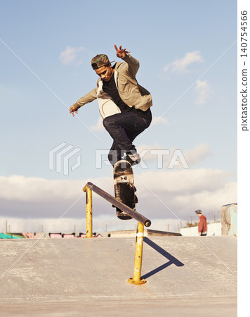 Energy, fitness and man with skateboard, jump or rail balance at a skate park for stunt training. Freedom, adrenaline and gen z male skater with air, sports or skill practice, exercise or performance Energy, fitness and man with skateboard, jump or rail balance at a skate park for stunt training. Freedom, adrenaline and gen z male skater with air, sports or skill practice, exercise or performance 140754566