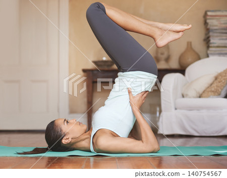 Yoga, stretching and woman on floor for fitness in home for training, exercise and healthy body. Pilates, cardio workout and person in yogi pose for wellness, mindfulness and warm up in living room 140754567