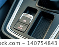 Electronic parking brake button in car interior 140754843
