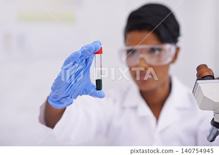 Blood, hand and scientist with test tube in laboratory for scientific research or experiment. Microscope, science and woman researcher with pharmaceutical dna in glass vial for medical study. Blood, hand and scientist with test tube in laboratory for scientific research or experiment. Microscope, science and woman researcher with pharmaceutical dna in glass vial for medical study. 140754945