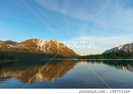 Kluane National Park, Yukon Territory, Canada: A breathtaking view of the mountains reflected in Lake Kathleen in the early morning. (Tourist attraction) Kluane National Park, Yukon Territory, Canada: A breathtaking view of the mountains reflected in Lake Kathleen in the early morning. (Tourist attraction) 140755164