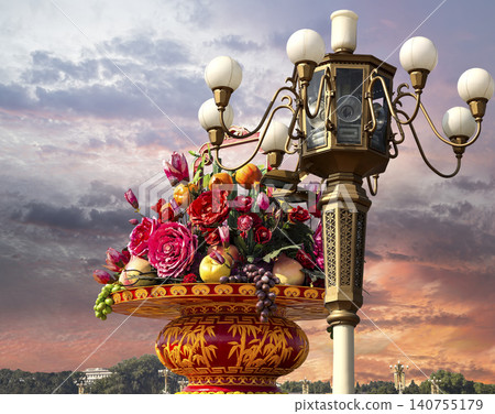 Street lamp and huge flower basket (against the sunset) in Tiananmen square, Beijing, China 140755179