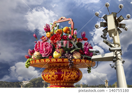 Street lamp and huge flower basket (against the background of a beautiful sky with clouds) in Tiananmen square, Beijing, China Street lamp and huge flower basket (against the background of a beautiful sky with clouds) in Tiananmen square, Beijing, China 140755180