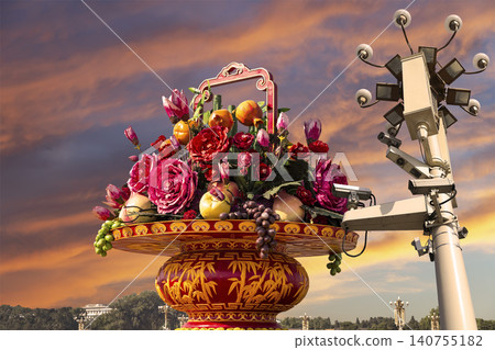 Street lamp and huge flower basket (against the sunset) in Tiananmen square, Beijing, China Street lamp and huge flower basket (against the sunset) in Tiananmen square, Beijing, China 140755182
