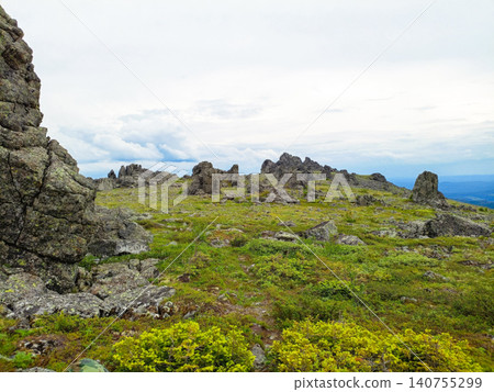 Mountain landscape with grass and stones. 140755299