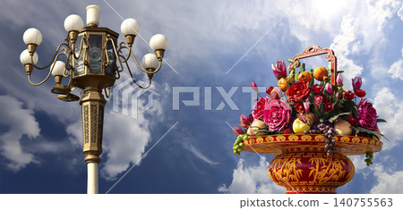 Street lamp and huge flower basket (against the background of a beautiful sky with clouds) in Tiananmen square, Beijing, China Street lamp and huge flower basket (against the background of a beautiful sky with clouds) in Tiananmen square, Beijing, China 140755563
