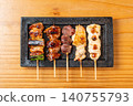 A juicy assortment of grilled chicken skewers, with the aroma of charcoal grilling that will whet your appetite. 140755793