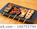 A juicy assortment of grilled chicken skewers, with the aroma of charcoal grilling that will whet your appetite. 140755794