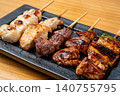 A juicy assortment of grilled chicken skewers, with the aroma of charcoal grilling that will whet your appetite. 140755795